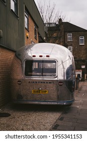 Wandsworth Town, London | UK -  2021.04.03: Shiny Airstream Style Caravan, Trailer Parked On The Sidewalk