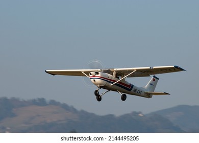 Wangen-Lachen, Switzerland, March 27, 2022 Cessna 150 Propeller Plane Take Off From A Small Airfield