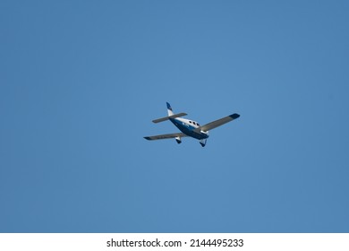 Wangen-Lachen, Switzerland, March 27, 2022 Piper PA28-181 Archer III Propeller Plane In The Blue Sky