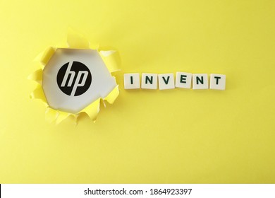 Wangsa Maju, Kuala Lumpur, Malaysia - December 1, 2020:  HP Logo On The Torn Paper Effect And Block Letters On Invent Isolated On Yellow Background 