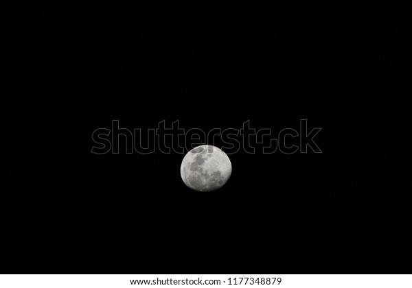 Waning gibbous\
moon detail on black\
background