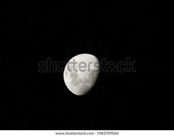 Waning gibbous moon in the\
night sky