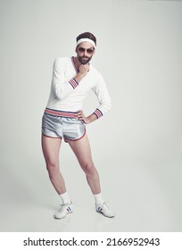 Wanna Go For A Jog. A Young Man In The Studio Wearing Retro Sportswear And Shades.