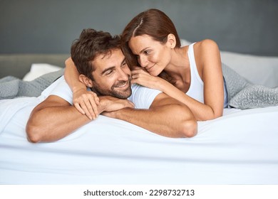 I want to love you forever and a day. a happy young couple relaxing in bed together at home. - Shutterstock ID 2298732713