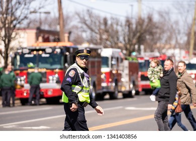 Wantagh, New York - March 17, 2019 : Nassau County Police Officer Directing Traffic Before The Beginning Of The First Annual St. Patrick’s Day Parade. Long Island