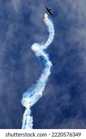 Wantagh, NY, USA May 23, 2008 A Stunt Pilot Performs A Corkscrew Maneuver In His Airplane In The Sky Over Wantagh, New York