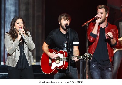 WANTAGH, NY-JUL 14: (L-R) Hillary Scott, Dave Haywood and Charles Kelley of Lady A perform during the You Look Good World Tour at Jones Beach Theatre on July 14, 2017 in Wantagh, New York.