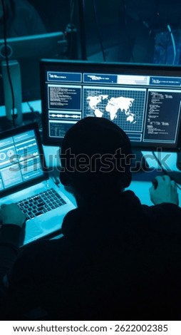 Wanted hackers coding virus ransomware using laptops and computers. Cyber attack, system breaking and malware concept.