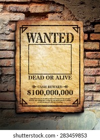 Wanted poster tacked on brick wall surface