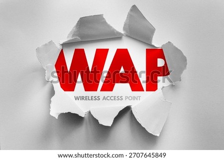 WAP acronym for Wireless Access Point revealed through torn paper, symbolizing wireless networking, connectivity hub, Wi-Fi extension, internet access, hotspot, and modern digital communication