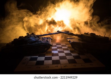 War between Russia and Ukraine, conceptual image of war using chess board and tank on a dark background of explosion. Ukrainian and Russian crisis, political conflict. Selective focus - Shutterstock ID 2211949229