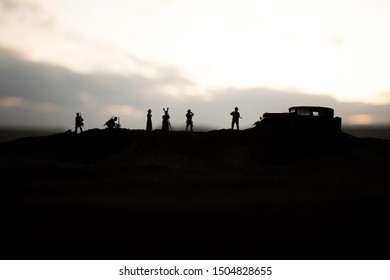 War concept. Creative composition. Silhouette of German general at the desert. Army commanders watching to the battle. Military fighting silhouettes on sunset