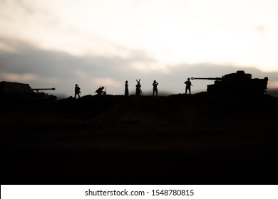 War concept. Creative composition. Silhouette of German general at the desert. Army commanders watching to the battle. Military fighting silhouettes on sunset