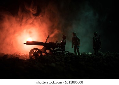 War Concept. Military silhouettes fighting scene on war fog sky background, World War Soldiers Silhouettes Below Cloudy Skyline At night. Attack scene. Vintage machine gun and soldiers during battle