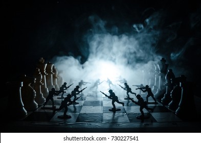 War Concept. Silhouettes Of Soldiers On Chessboard. War Concept. Military Silhouettes Fighting Scene On War Fog Sky Background, Chess Board Game Concept Of Business Ideas And Competition And Strategy