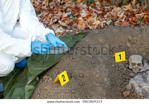 War crime investigation. Forensic science
specialist at work.