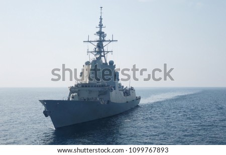 A war frigate ship sailing at sea in summer.