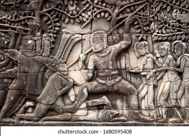 War Scene On 12th Century Relief Of Bayon Temple, Cambodia. Historical Artwork On Wall Of Khmer Landmark In Angkor. UNESCO World Heritage Site.