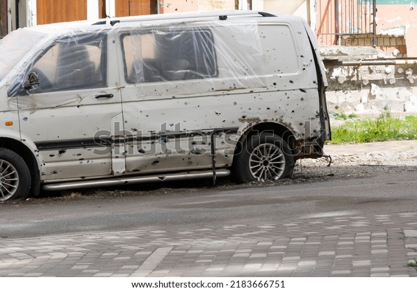 war in Ukraine. Car graveyard.\
Cars of civilians were shot. Russia\'s war against Ukraine. Exploded\
car. Cars damaged after shelling. irpin bucha. war\
crimes