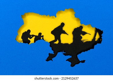 War in Ukraine, illustration photo, Ukraine colors blue and yellow. Silhouette of Ukraine map, black tanks in the background. Conflict between Russia and Ukraine - Powered by Shutterstock