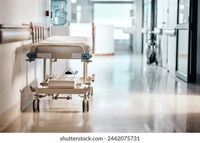 Ward, hospital and bed in a lobby, healthcare or wellness with furniture or interior with help or risk. Hallway, clinic or emergency service with surgery or medical center with bacteria or facility - Powered by Shutterstock