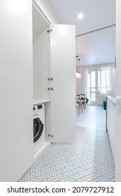 Wardrobe For Washer And Dryer In The Hallway Of A Small Apartment