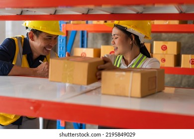 Warehouse Asian Employees Working Together On Counting Products And Checking Inventory In Storage.