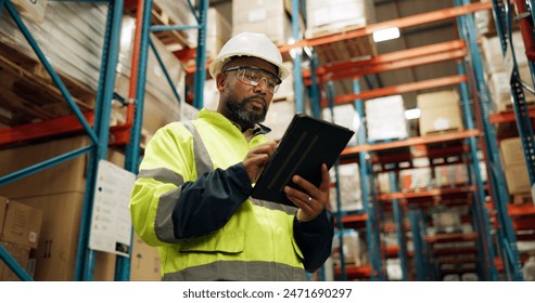 Warehouse, black man and manufacturing with tablet, inventory and checklist in a factory. African person, worker and employee with tech and inspection with digital app for logistics and online stock - Powered by Shutterstock