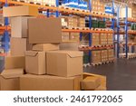 Warehouse with boxes. Logistics center. Storage area of industrial enterprise. Stack of boxes. Warehouse racks with barrels and parcels. Storehouse for factory. Warehouse without anyone. Art focus