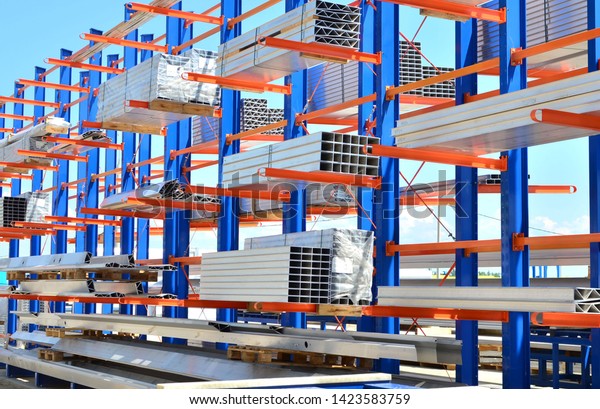 Warehouse Cantilever Racking\
Systems for storage Aluminum Pipe or profiles. Pallet Rack and\
Industrial Warehouse Racking. Steel profiles, sheet metal\
build-profile - Image