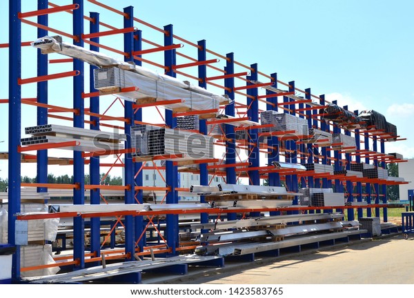 Warehouse Cantilever Racking\
Systems for storage Aluminum Pipe or profiles. Pallet Rack and\
Industrial Warehouse Racking. Steel profiles, sheet metal\
build-profile - Image