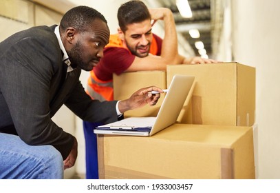 Warehouse Clerk And Boss At The Laptop Computer In Shipping Planning Delivery In Online Trade