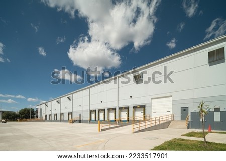 Warehouse facade on a sunny day. Loading dock.