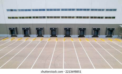 Warehouse Gates For Loading And Unloading Cargo In A Distributed Center. Loading And Unloading Areas For Trucks. The Warehouse Building Is Outside. 