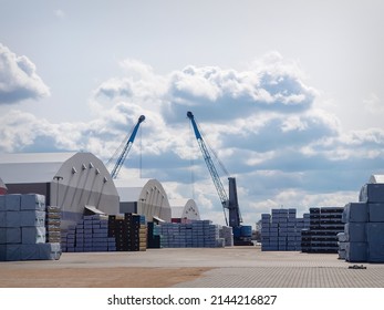 Warehouse hangars of the cargo port, blue cloudy sky, background