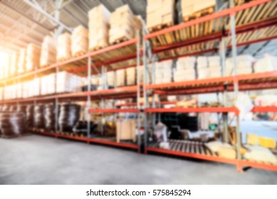 Warehouse industrial and logistics companies. Long shelves with a variety of boxes and containers. Bright sunlight. Deep blur effect.