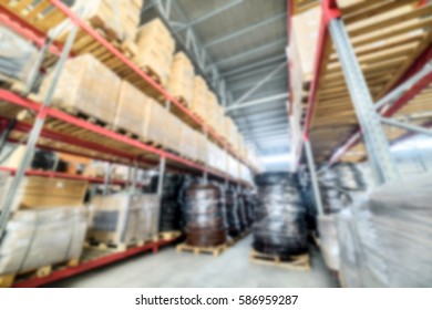 Warehouse industrial and logistics companies. Long shelves with a variety of boxes and containers. Deep blur effect.