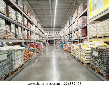 Warehouse industrial premises for storing material. Warehouse of building materials in industiral store. Concept logistics, transport
