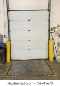Warehouse interior, man door, loading dock, overhead door.
