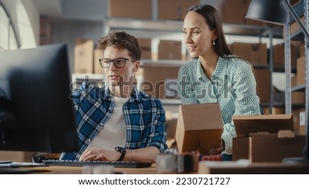Warehouse Inventory Manager and Worker Using Desktop Computer, Preparing a Parcel for Shipping. Small Business Owners Working in Storeroom, Preparing Online Orders for Clients. Slow Motion