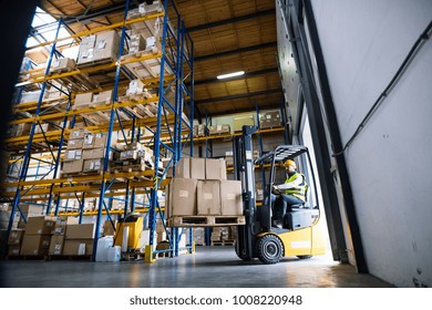 Warehouse Man Worker With Forklift.