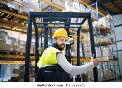 Warehouse Man Worker With Forklift.