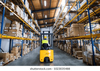 Warehouse Man Worker With Forklift.