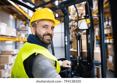 Warehouse Man Worker With Forklift.