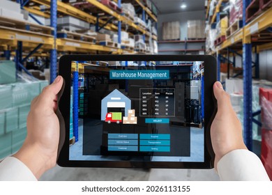 Warehouse management innovative software in computer for real time monitoring of goods package delivery . Computer screen showing smart inventory dashboard for storage and supply chain distribution .
