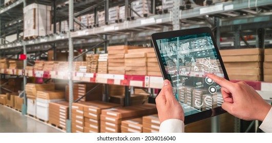 Warehouse management innovative software in computer for real time monitoring of goods package delivery . Computer screen showing smart inventory dashboard for storage and supply chain distribution . - Shutterstock ID 2034016040