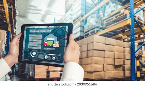Warehouse management innovative software in computer for real time monitoring of goods package delivery . Computer screen showing smart inventory dashboard for storage and supply chain distribution .