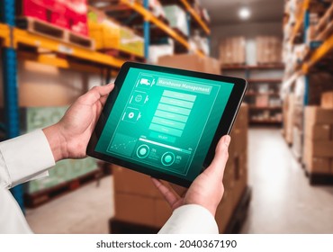 Warehouse management innovative software in computer for real time monitoring of goods package delivery . Computer screen showing smart inventory dashboard for storage and supply chain distribution .