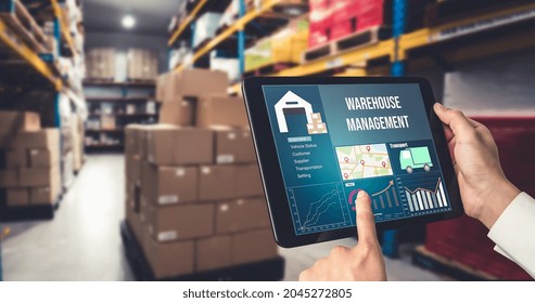 Warehouse management innovative software in computer for real time monitoring of goods package delivery . Computer screen showing smart inventory dashboard for storage and supply chain distribution .