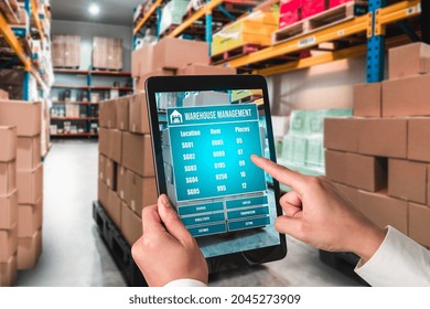 Warehouse management innovative software in computer for real time monitoring of goods package delivery . Computer screen showing smart inventory dashboard for storage and supply chain distribution .